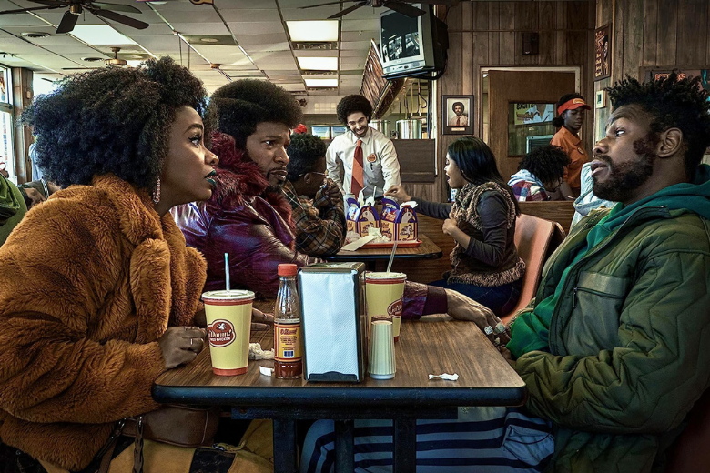 Scene from They Cloned Tyrone on Netflix featuring Fontaine, Yo-Yo, and Slick Charles talking. 